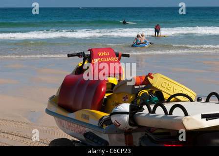 A Jet Ski belonging to the Royal National Lifeboat Institution parked on Porthmeor Beach at St Ives, Cornwall. Stock Photo