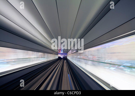 Opened in 2010, the Dubai Metro, MRT, in motion approaching a station, Dubai, United Arab Emirates Stock Photo