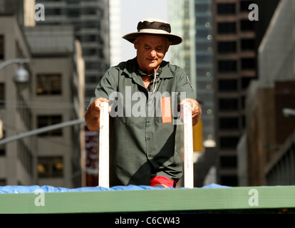 Bill Murray diving into a makeshift pool while filming a segment outside The Ed Sullivan Theater for the 'Late Show with David Stock Photo