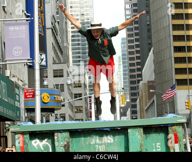 Bill Murray diving into a makeshift pool while filming a segment outside The Ed Sullivan Theater for the 'Late Show with David Stock Photo