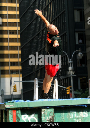 Bill Murray diving into a makeshift pool while filming a segment outside The Ed Sullivan Theater for the 'Late Show with David Stock Photo