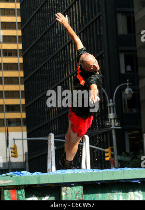 Bill Murray diving into a makeshift pool while filming a segment outside The Ed Sullivan Theater for the 'Late Show with David Stock Photo