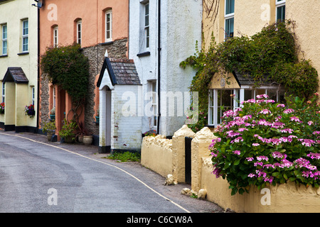 A lane of colourful whitewashed and pebbledashed houses in the seaside village of Morthoe near Woolacombe north Devon England UK Stock Photo