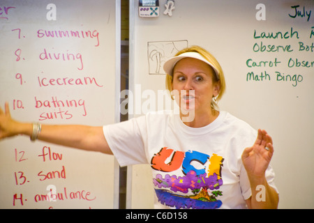 An enthusiastic English teacher lectures on vocabulary to her class in a summer learning program at the University of California Stock Photo