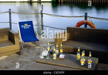 Emptied bottles of Hessian local cider drink (Apfelwein) left behind on a table in King Kamehameha Beach Club in Offenbach. Stock Photo