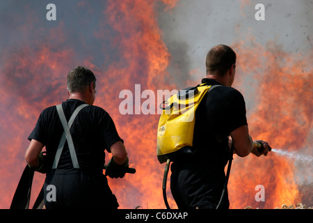 Firefighters tackle a large field fire in Essex Stock Photo