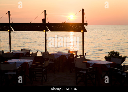 Sunset seen from a tavern at sea, Molivos, Greece Stock Photo