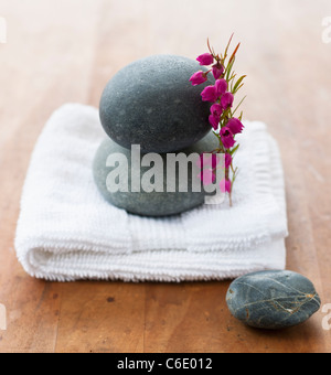 Stones on towel at spa Stock Photo