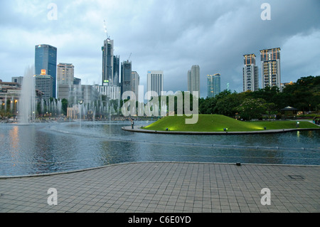 KLCC Park at the Petronas Twin Towers in front of the skyline with office buildings and hotels, Kuala Lumpur, Malaysia, Asia Stock Photo