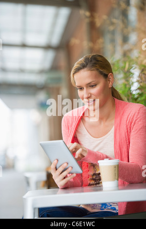 USA, New Jersey, Jersey City, woman using tablet in cafe Stock Photo