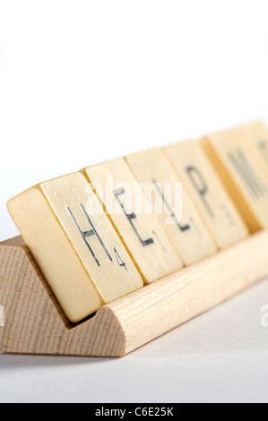 Help spelled with scrabble tiles Stock Photo