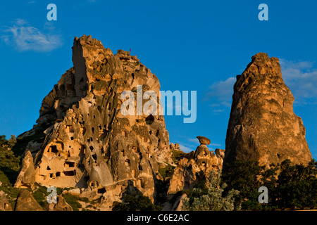 Old troglodytic cave dwellings and rock Castle in Uchisar, Turkeyrock castle citadel of Uchisar Cappadocia Turkey Stock Photo