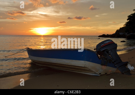 Motorboat at sunset on the beach of Panuba, Pulau Tioman Island, Malaysia, Southeast Asia, Asia Stock Photo