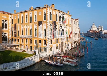 Water taxis passing Palazzo Cavalli-Franchetti, Grand Canal, Venice, Veneto, Italy Stock Photo