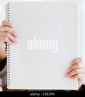 USA, New Jersey, Jersey City, Close up of woman's hands holding blank notebook Stock Photo