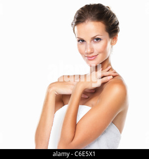 Studio portrait of beautiful woman wrapped in towel Stock Photo
