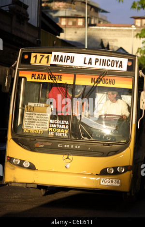 Public bus stopping to pick up passengers on Avenida Rosas in the city center. Santiago, Chile, South America Stock Photo