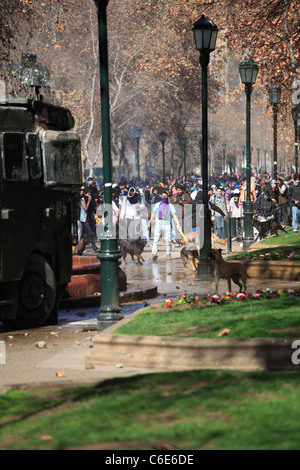 Chilean police water cannon disperse protesters during a student strike in Santiago's Downtown, Chile.