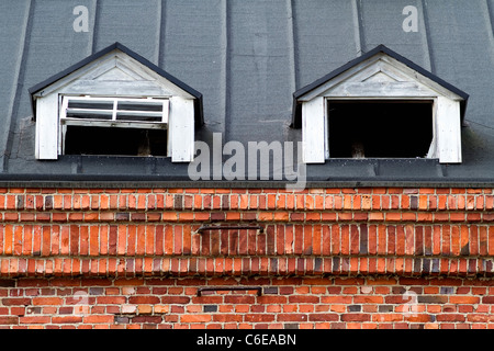 While the rest of this old hydroelectric power plant was in tip top condition these two roof windows make an exception Stock Photo