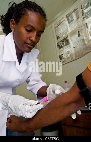 Patient having blood taken as part of a HIV/AIDS blood testing session Stock Photo