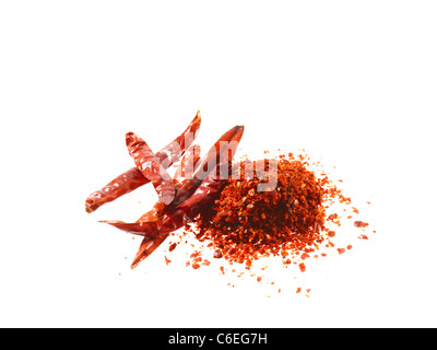 Studio shot of Red Chili Powder and Whole Red Chilies on white background Stock Photo