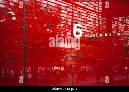 England, Greater London, Southwark. Pedestrians walking past '6 More London Place' office space development near the River Thame Stock Photo