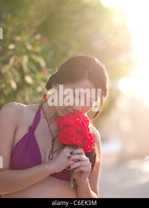USA, Arizona, Scottsdale, Mid adult woman smelling bouquet Stock Photo