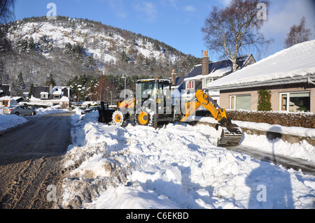 Village life after snow storm, Ballater, Royal Deeside, Scotland. Stock Photo