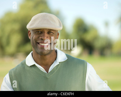 USA, Arizona, Scottsdale, Smiling man on golf course Stock Photo