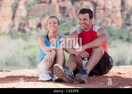 USA, Arizona, Sedona, Young couple enjoying view in desert after hiking