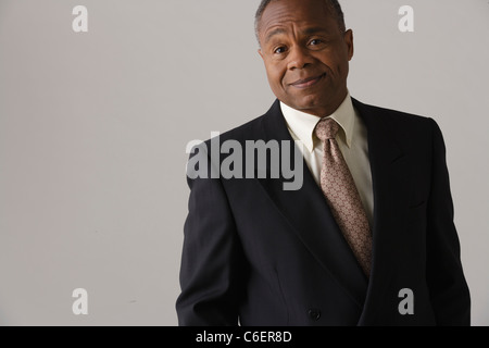 Portrait of mature businessman, studio shot Stock Photo