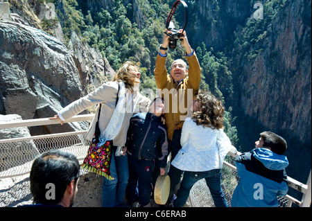 President Felipe Calderon of Mexico takes a photo of his family at the rim of Copper Canyon Stock Photo