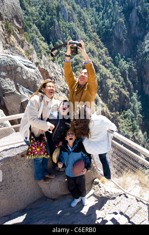 President Felipe Calderon of Mexico takes a photo of his family at the rim of Copper Canyon Stock Photo