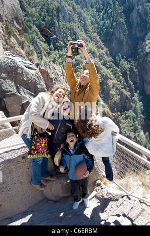 President Felipe Calderon of Mexico takes a photo of his family at the rim of Copper Canyon Stock Photo