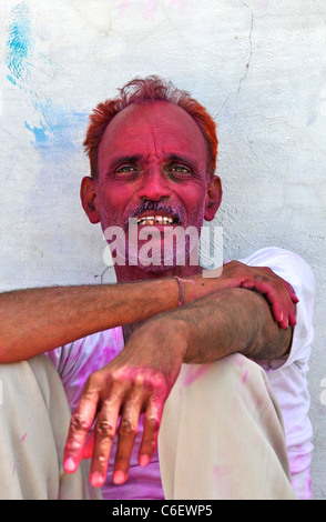 Man with painted face after celebrating Holi Festival Jojawar Rajasthan India Stock Photo