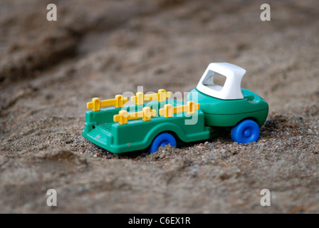 Plastic toy car in sand Stock Photo