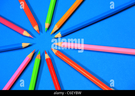 Multi-coloured pencils or crayons in a circle Stock Photo
