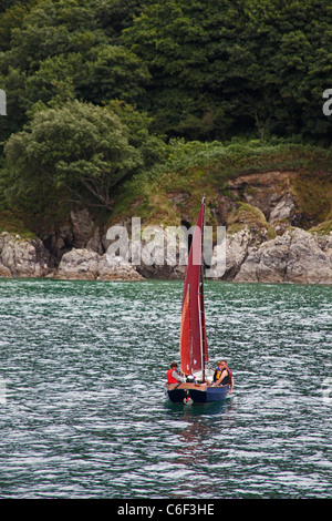 A Salcombe yawl dinghy in the Salcombe Estuary, Devon, England, UK Stock Photo