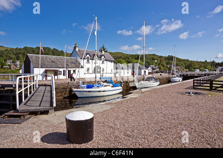Sailing boats are waiting for the sea lock of Caledonian Canal at Corpach near Fort William in Lochaber to open to Loch Linnhe Stock Photo
