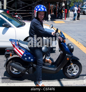 Young Man on Stars and Stripes Scooter, San Francisco Stock Photo