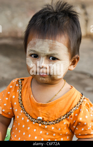 Young child with thanaka on face, Burma (Myanmar) Stock Photo