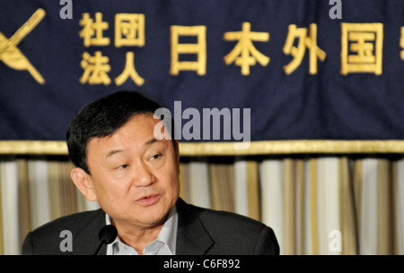 Former Thai Prime Minister Thaksin Shinawatra speaks before foreign and domestic journalists during a news conference. Stock Photo