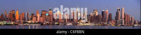 New York City Manhattan sunset panorama with historical skyscrapers over Hudson River with beautiful red color Stock Photo