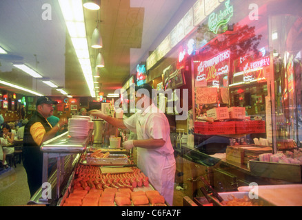 looking in the window of Katz Delicatessen in Manhattan NYC Stock Photo