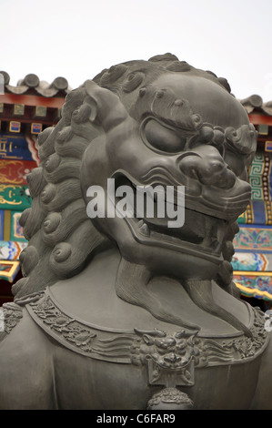 bronze lion guarding the imperial summer palace in beijing Stock Photo