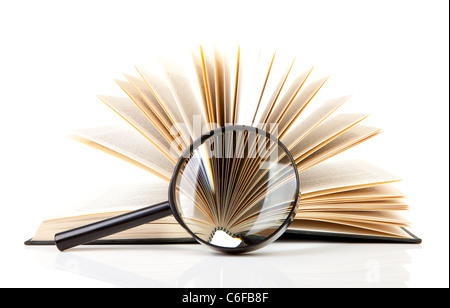 open book with magnifying glass over white background Stock Photo - Alamy