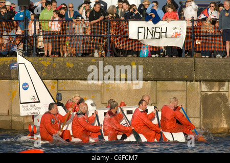The annual Mumbles Raft Race in Swansea Bay which is held to help raise funds for the RNLI. Stock Photo