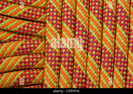 detail of a new orange, yellow, and red climbing rope Stock Photo