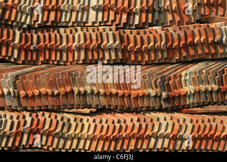 rows of ceramic tiles piled up during a temple restoration Stock Photo