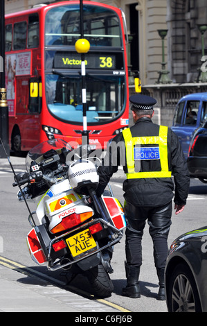 Police officer and motorcycle, Westminster, London, Britain, UK Stock Photo